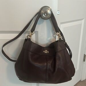 Coach dark purple pebbled leather purse. Crossbody strap. used a few times.